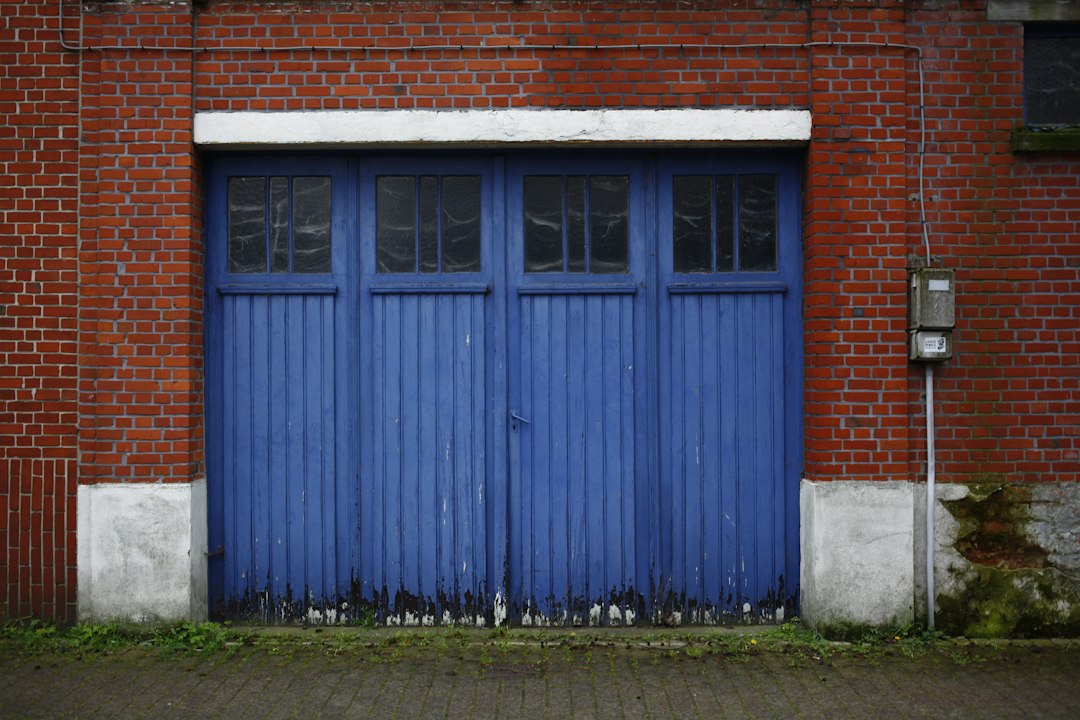 A red brick building with a blue door in Huntington Beach, CA